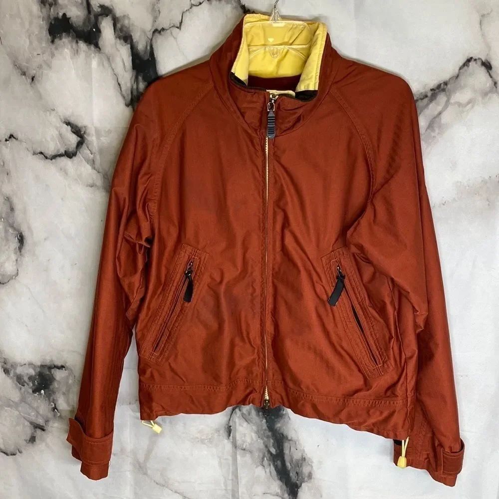 *Nike burgundy ski coat with yellow trim *